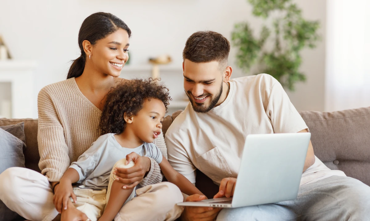 A family looking at a laptop